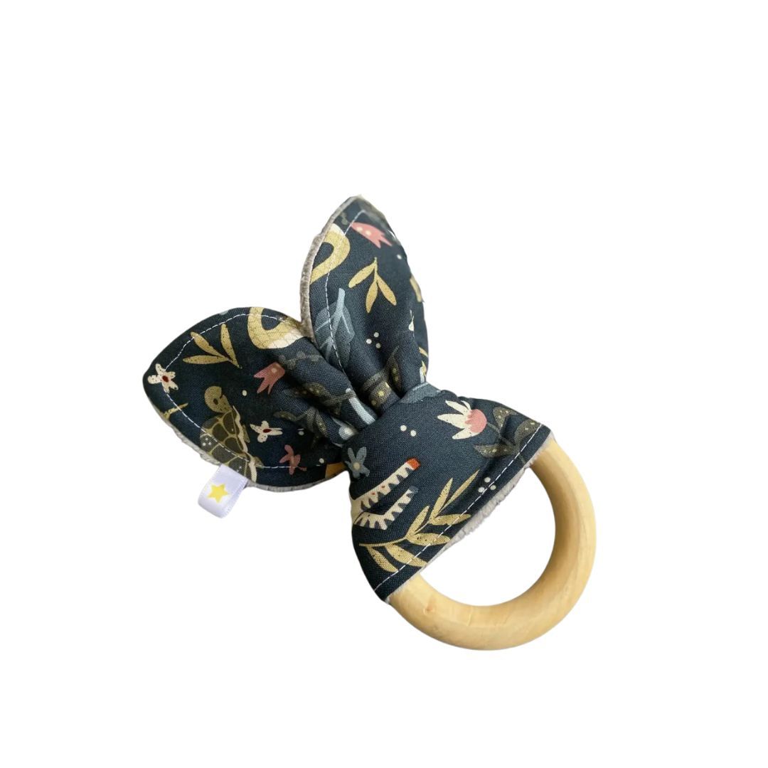 Welcome to the Jungle Bunny Teether – A natural, non-toxic wooden teether with soft jungle-print fabric. Safe, smooth, and perfect for soothing sore gums.