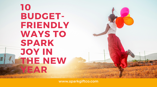 Spark gift company blog graphic woman in red skirt jumping in air with balloons and text overly that reads "10 budget friendly ways to spark joy in the new year"