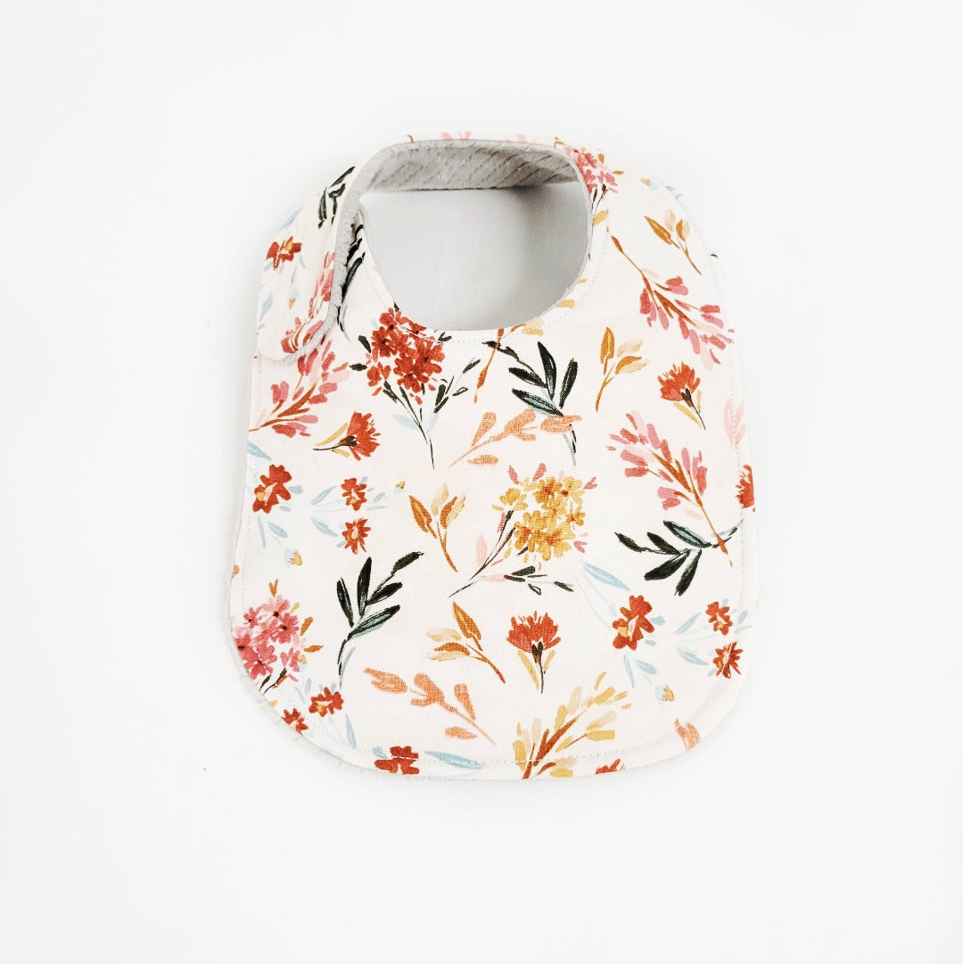 Floral patterned baby bib with white background