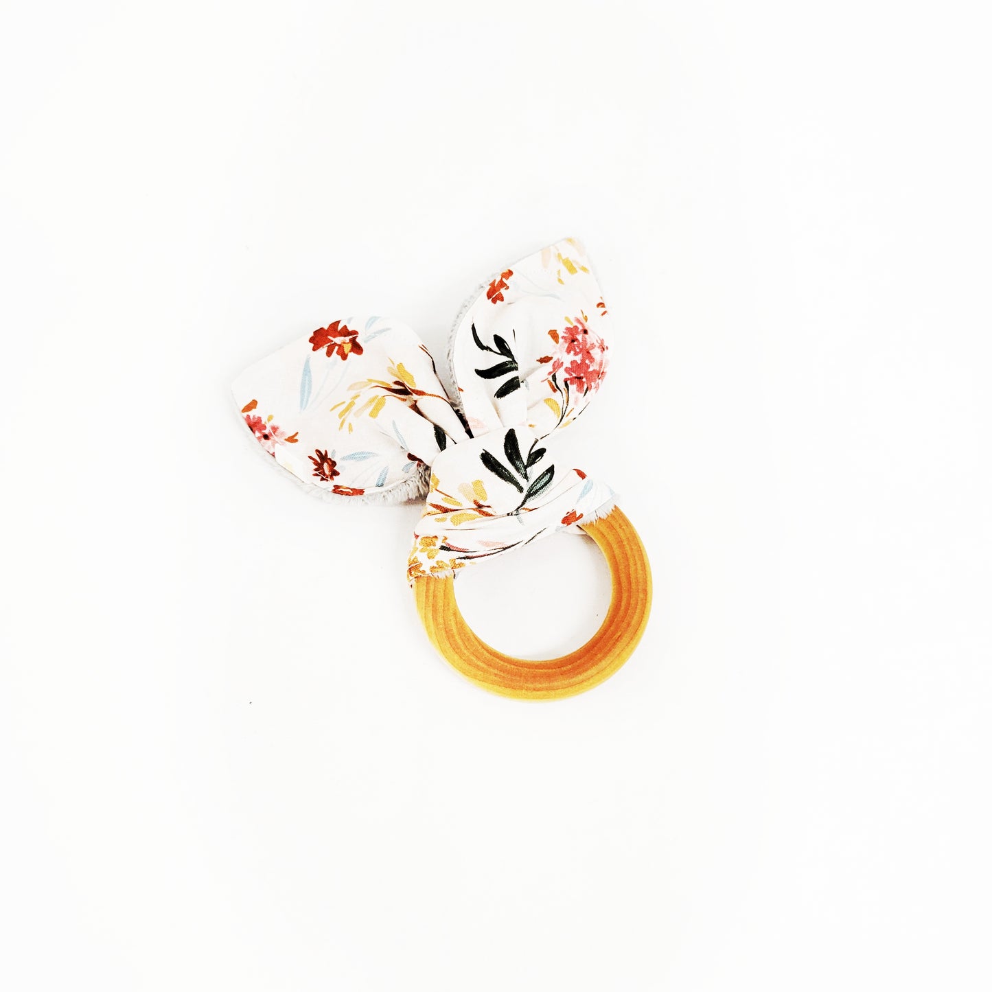 floral patterned teether on white background