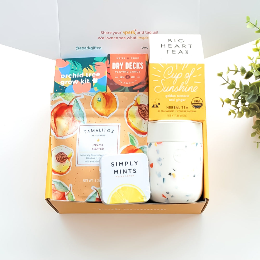 Golden Bloom Gift Box with an orchid tree grow kit, herbal tea sampler, terrazzo ceramic tumbler, assorted lollipop, and peach candy—perfect for nature lovers and thoughtful gifting.