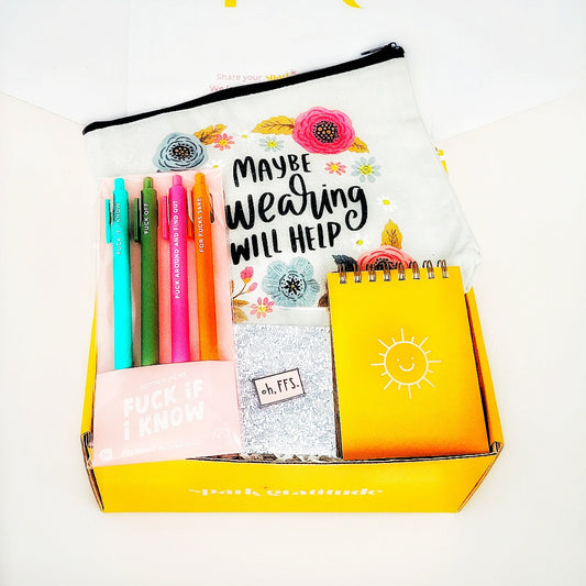 Just Gotta Swear Gift Box with a "Maybe Swearing Will Help" canvas pouch, "FFS" pin, "Fuck if I Know" jotter pen set, and Sunshine notepad—perfect for stress relief, office humor, and anyone who believes in the power of a good curse word. Ships anonymously for extra fun!