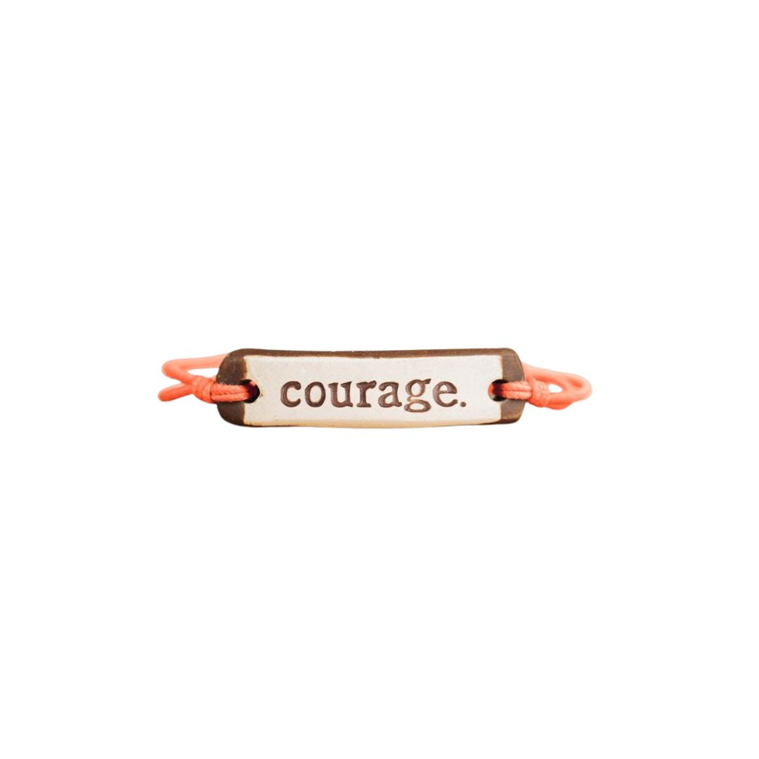 MudLOVE "Courage" Bracelet in Coral – A handcrafted, adjustable clay bracelet with an elastic cord. Waterproof, ethically made & perfect for everyday wear.

